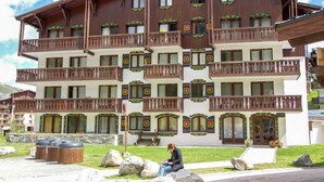 A multi-story hotel with balconies, large windows, and a central entrance. - Chalet Club (Val Claret) by Interhome (Tignes)