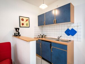 Fridge, microwave, cookware/dishes/utensils