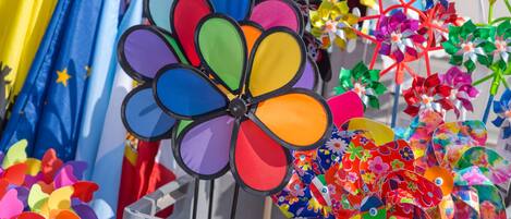 A display of colorful pinwheels and umbrellas.