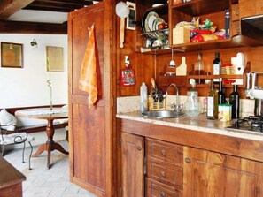 Fridge, cookware/dishes/utensils, dining tables