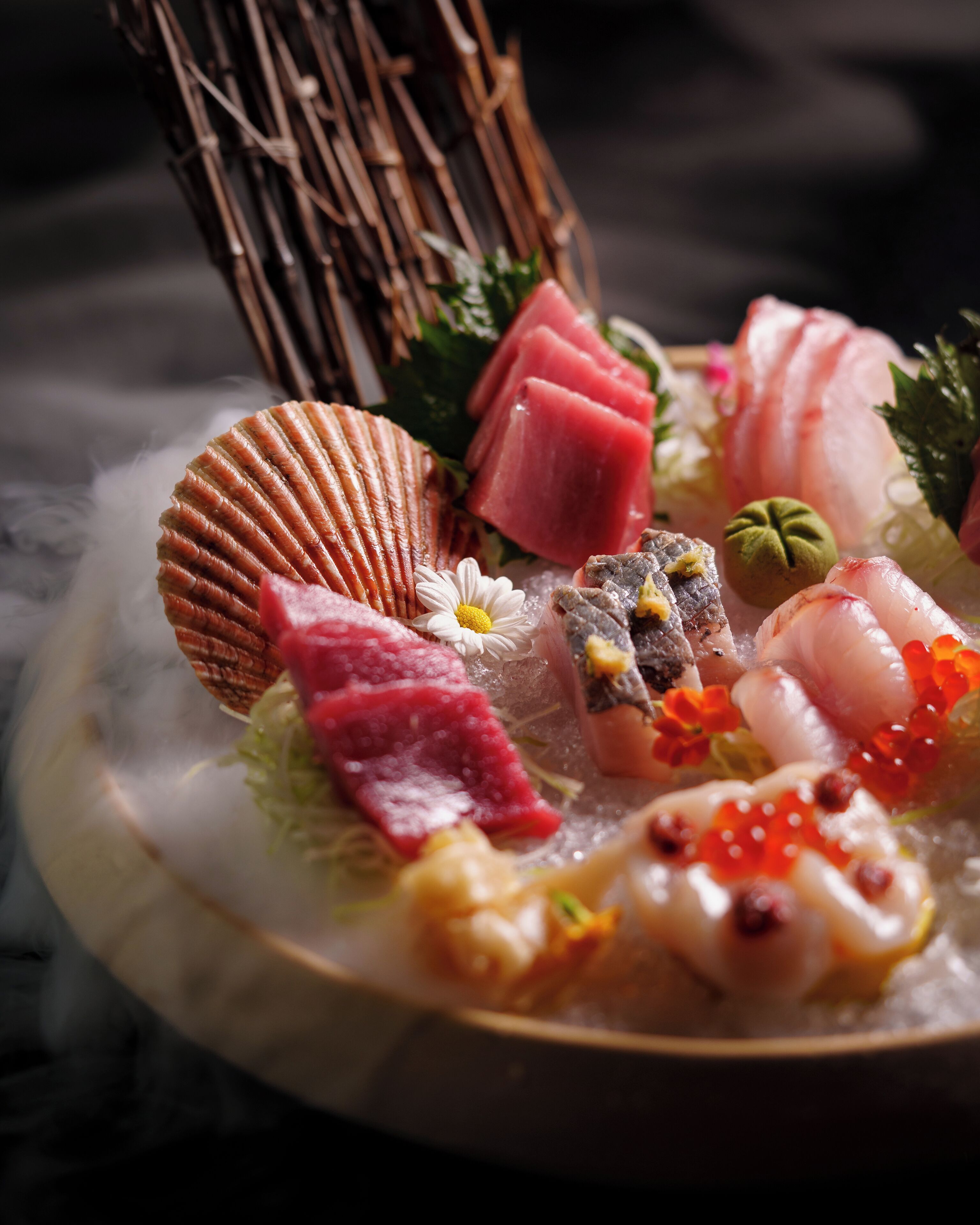 A variety of sushi dishes on a plate with a decorative background.