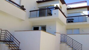 A multi-story residential building with balconies, staircases, and a clear sky. - Mar Nou by Interhome (Llançà)