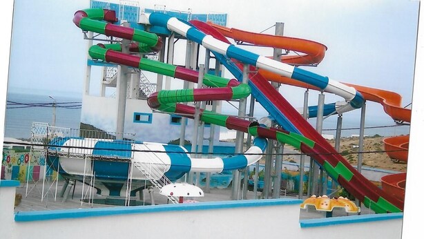 A water park with multiple slides and a pool area. - Town house in Aglou Plage "chez Laurent": Ocean and Mountain  (Unknown)