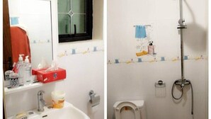 Ein Badezimmer mit Waschbecken, Toilette und Dusche.