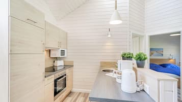 Fridge, stovetop, dishwasher, coffee/tea maker