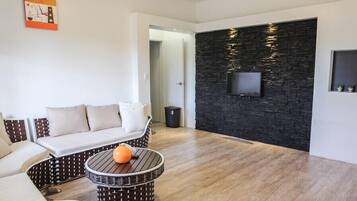 Deluxe Villa, 1 Bedroom | Living area | Flat-screen TV