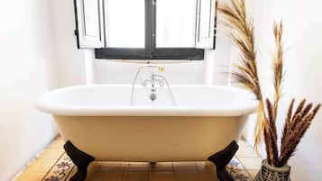 Bathtub, hair dryer, towels, soap