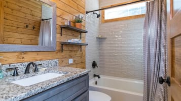 Bathtub, hair dryer, towels