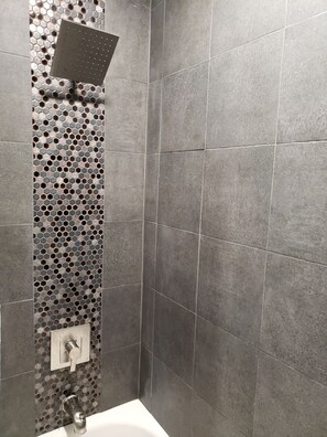 Bathtub, hair dryer, towels, soap