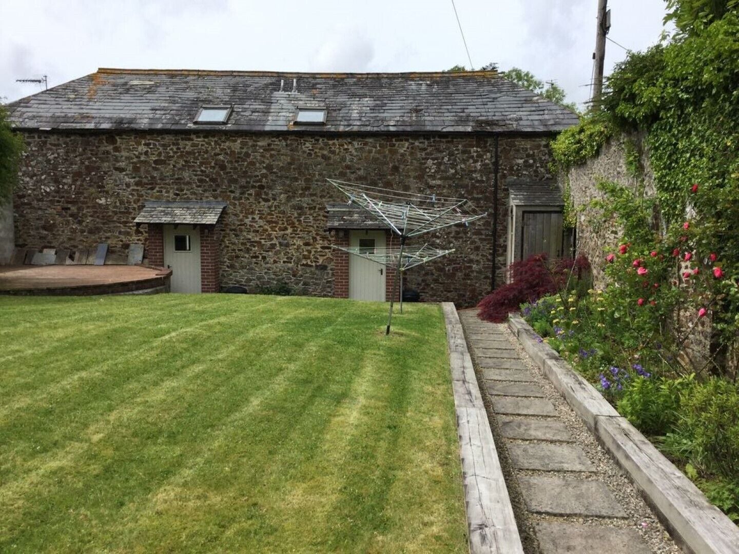 East facing walled garden. Coach on right, Stable on the left.