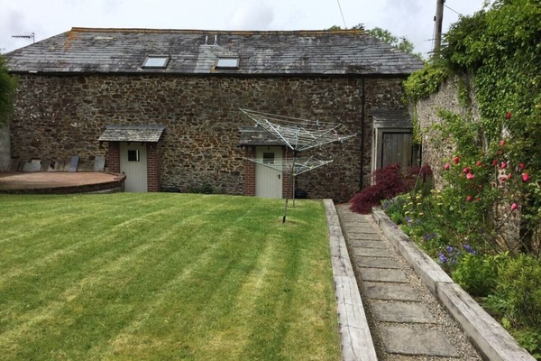 East facing walled garden. Coach on right, Stable on the left.