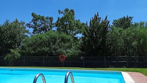 A swimming pool with a metal ladder, surrounded by a fence and trees. - Independent flat 2 pax downstairs, in Villa, Siena View, Pool A/C, organic Farm (Siena)