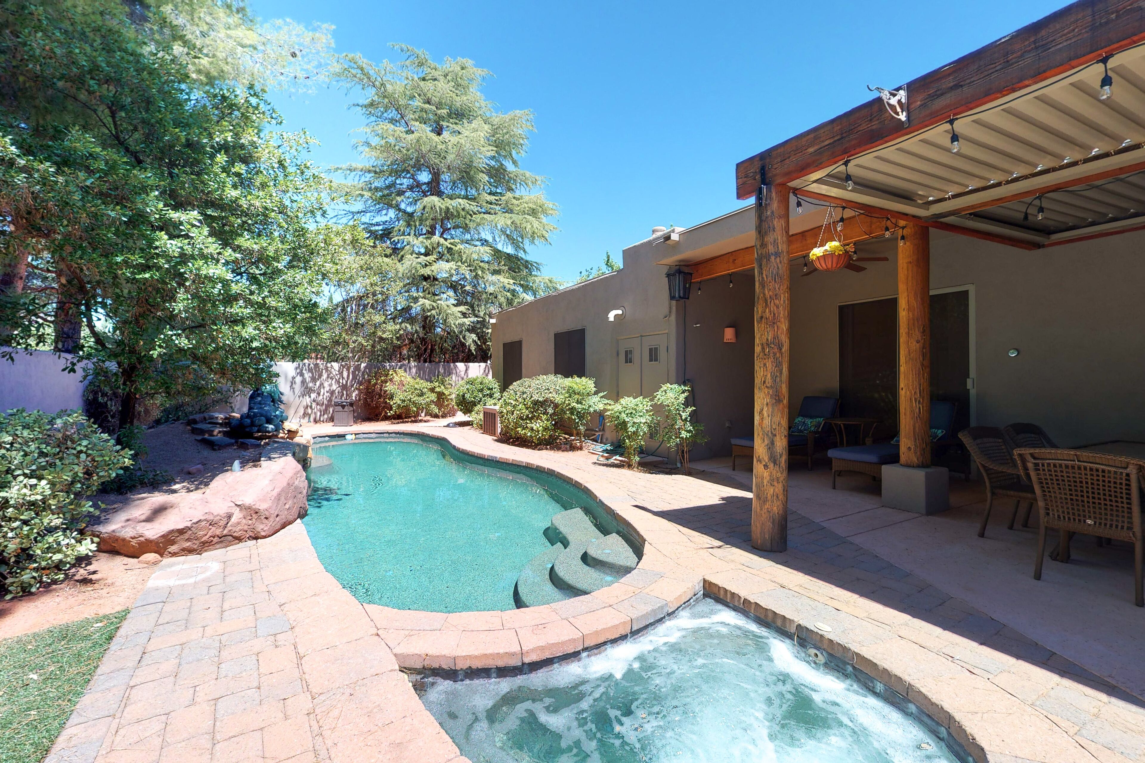 Updated home with private pool, hot tub & grill in tranquil backyard