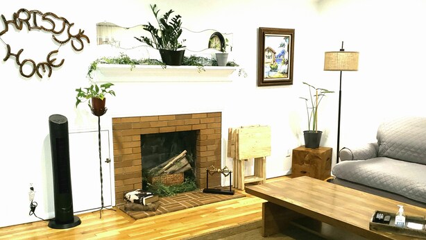 A living room with a fireplace, a sofa, a coffee table, and a lamp. - MOTELS ARE GROSS
BEAUTIFUL RANCH STYLE
Approx 145 Nightly

DISCOUNTS AVAILABLE 
 (Columbus)