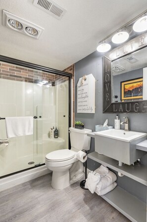 Combined shower/tub, hair dryer, towels, soap