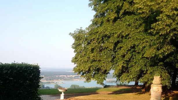A hot tub with a view of a lake and a tree. - Domain House - Landin Castle (LE LANDIN)