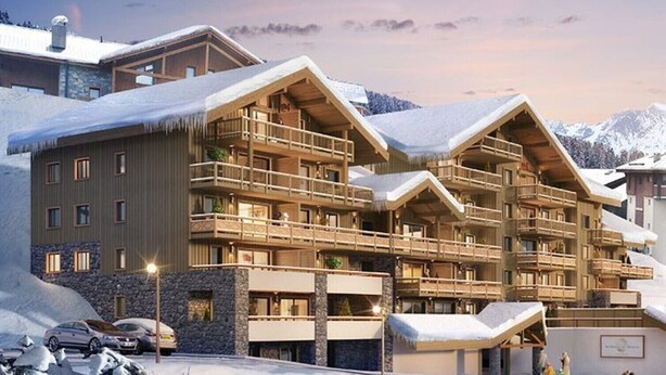 A multi-story hotel with balconies, stone facade, and snow-covered surroundings. - Interior comfort and divine sensations outside. New MGM apartment. (Peisey-Vallandry)