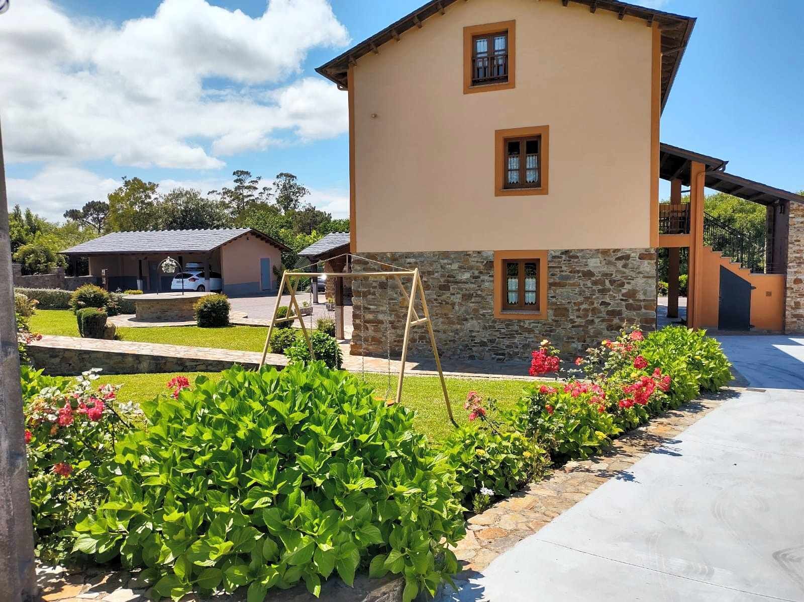 A two-story house with a stone facade and a flat roof.