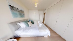 A bedroom with a bed, pillows, a bedside table, and a wardrobe. - ❤MAMILLA 2 bdrs w. view ❤ My BEST JLM Experience ❤ (Jerusalem)