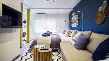 Deluxe House, 1 Bedroom | Living room | Flat-screen TV