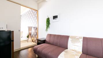 Comfort Apartment, 1 Bedroom | Living area | Flat-screen TV