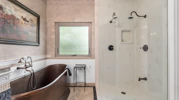 Combined shower/bathtub, hair dryer, towels, soap