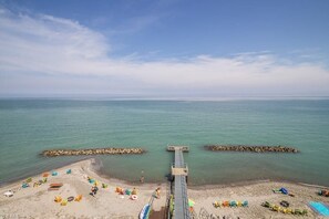 On the beach, sun-loungers, beach towels