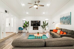 Smart TV, fireplace, foosball, books