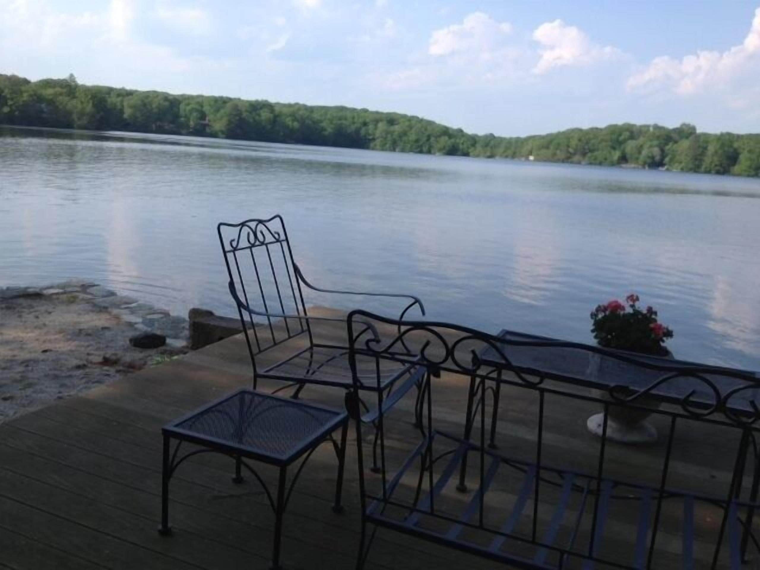 Water's edge deck with seating to enjoy the activity or tranquility!