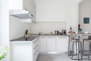 Fridge, microwave, stovetop, coffee/tea maker