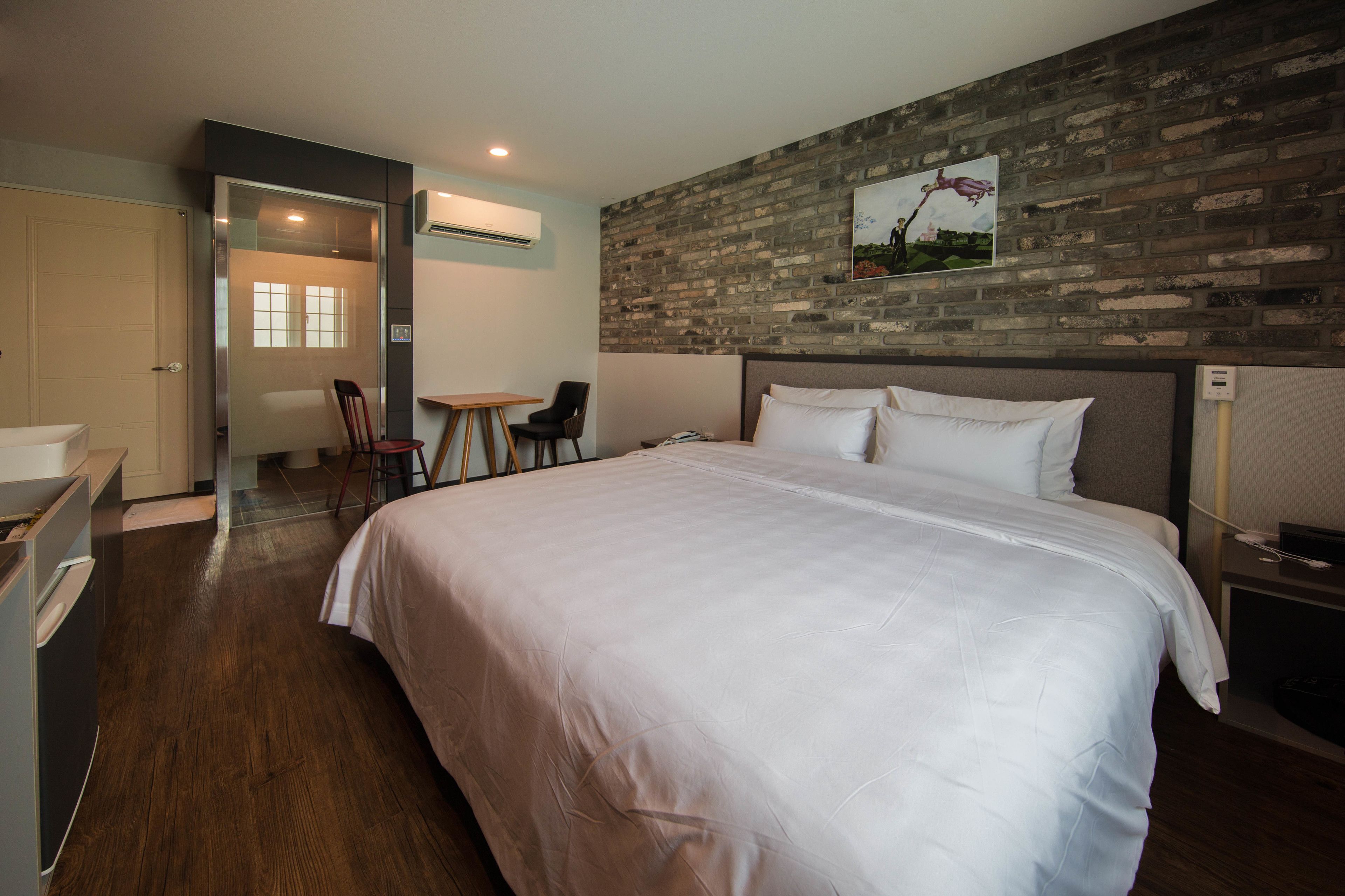 deluxe king room | premium bedding, desk, laptop workspace, blackout curtains