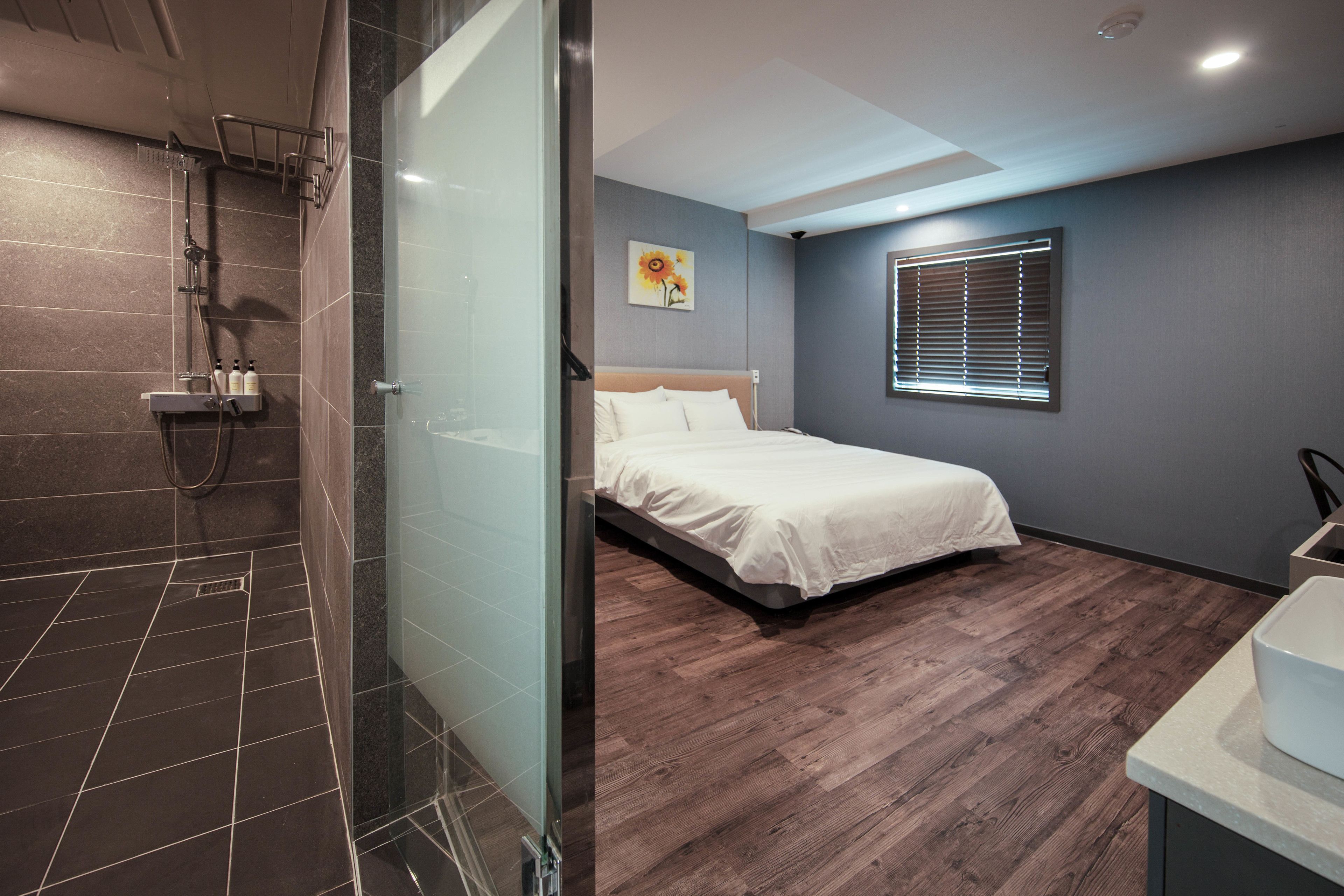 deluxe king room | premium bedding, desk, laptop workspace, blackout curtains