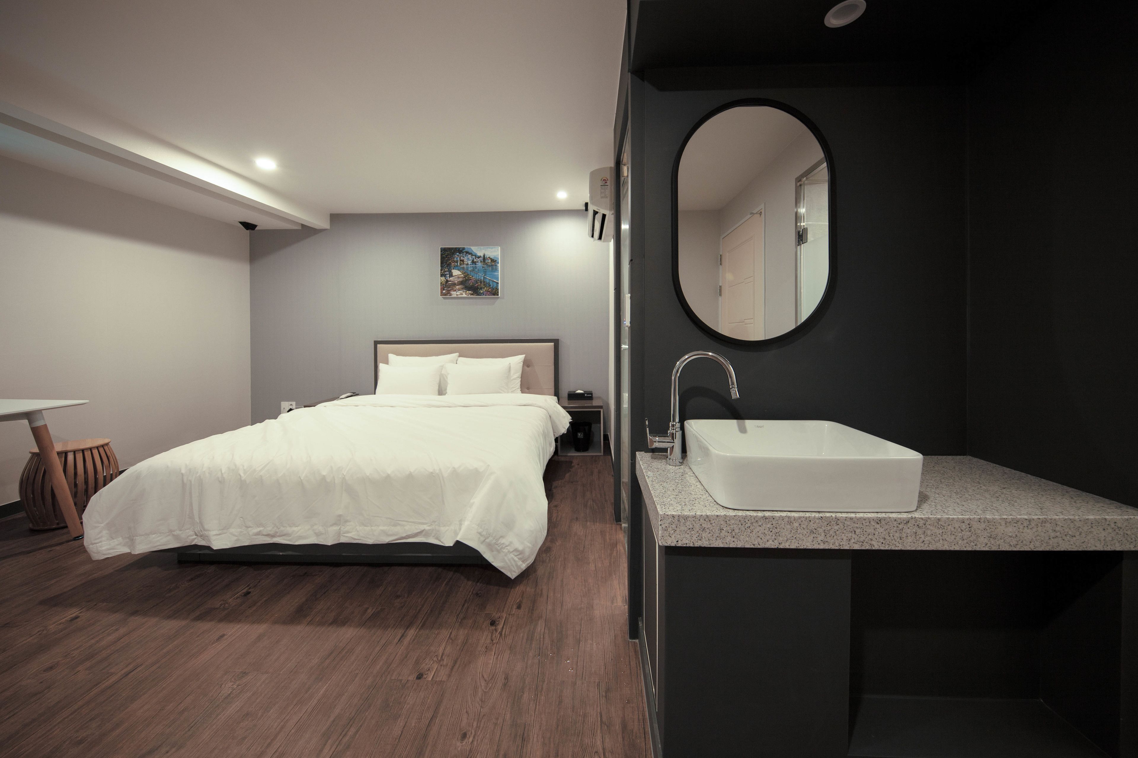 premier deluxe king room | premium bedding, desk, laptop workspace, blackout curtains