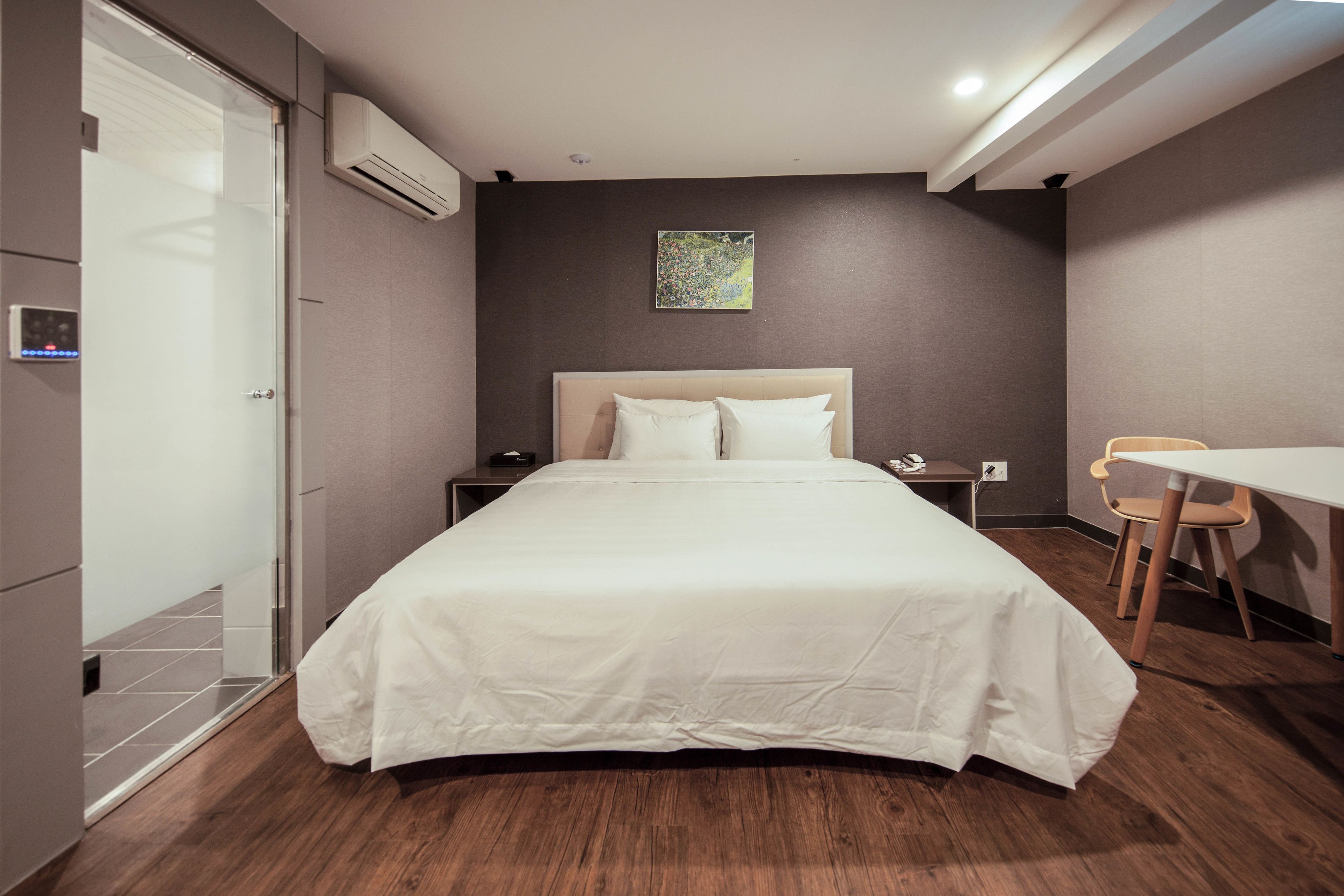 premier deluxe king room | premium bedding, desk, laptop workspace, blackout curtains