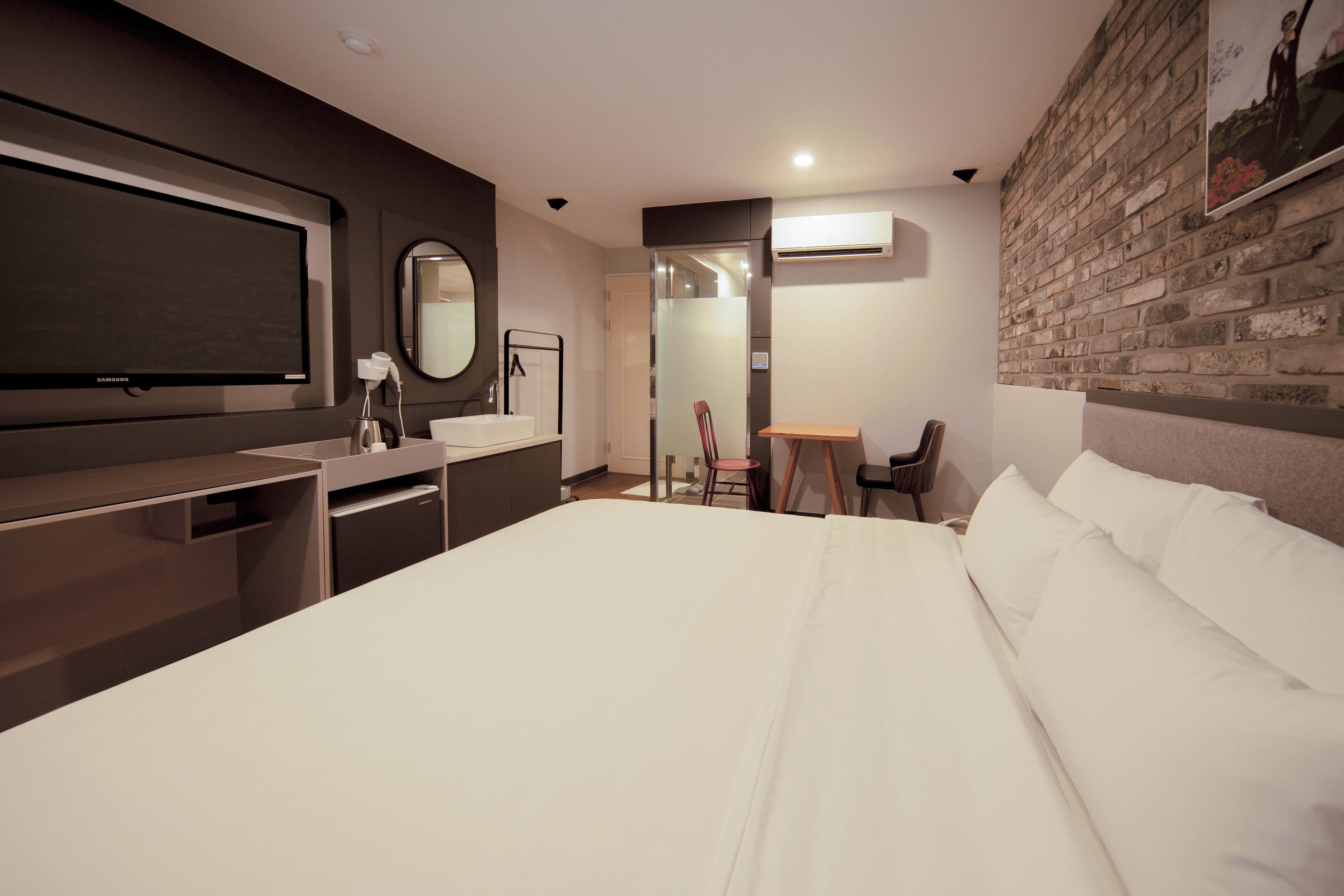 deluxe king room | premium bedding, desk, laptop workspace, blackout curtains