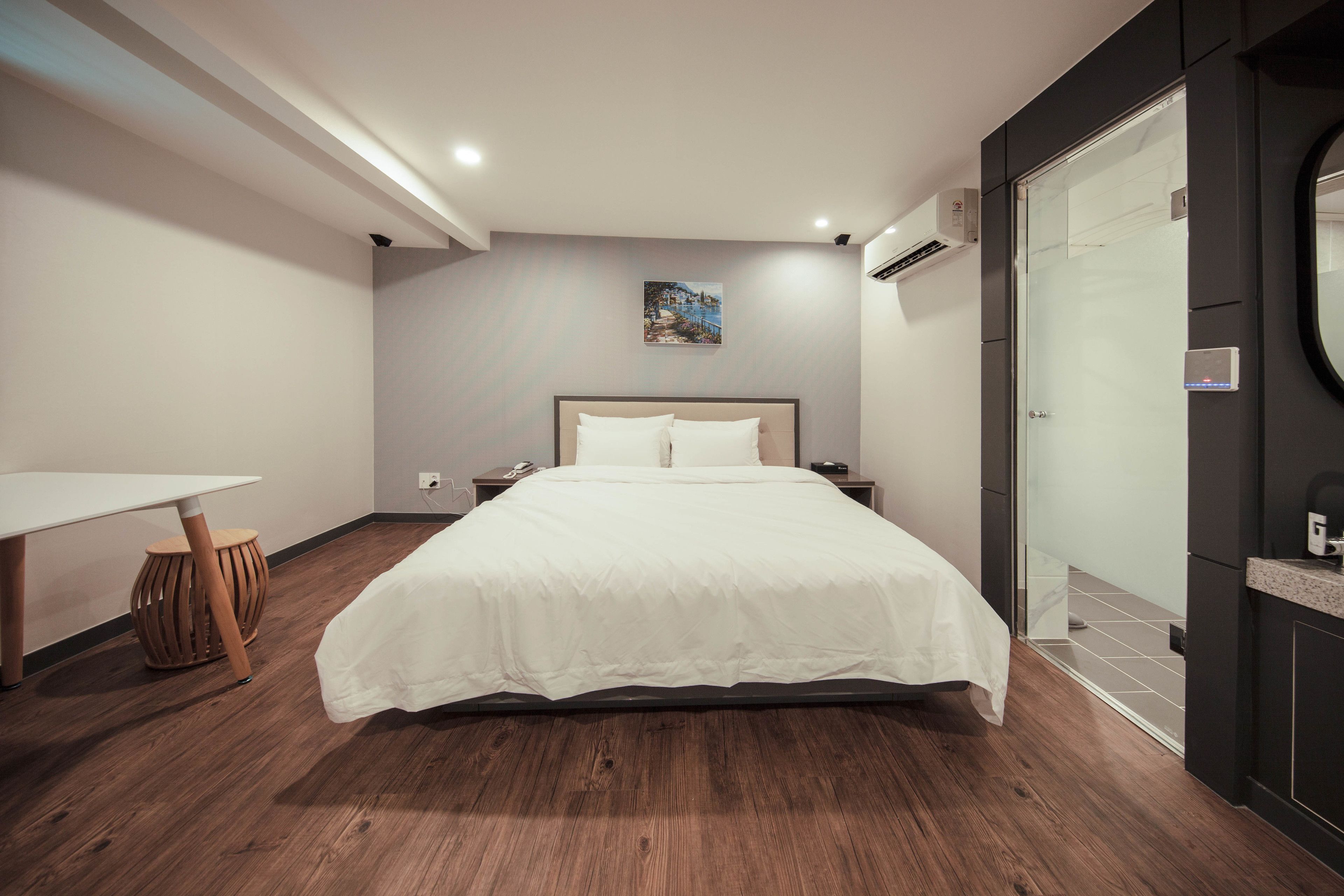 premier deluxe king room | premium bedding, desk, laptop workspace, blackout curtains