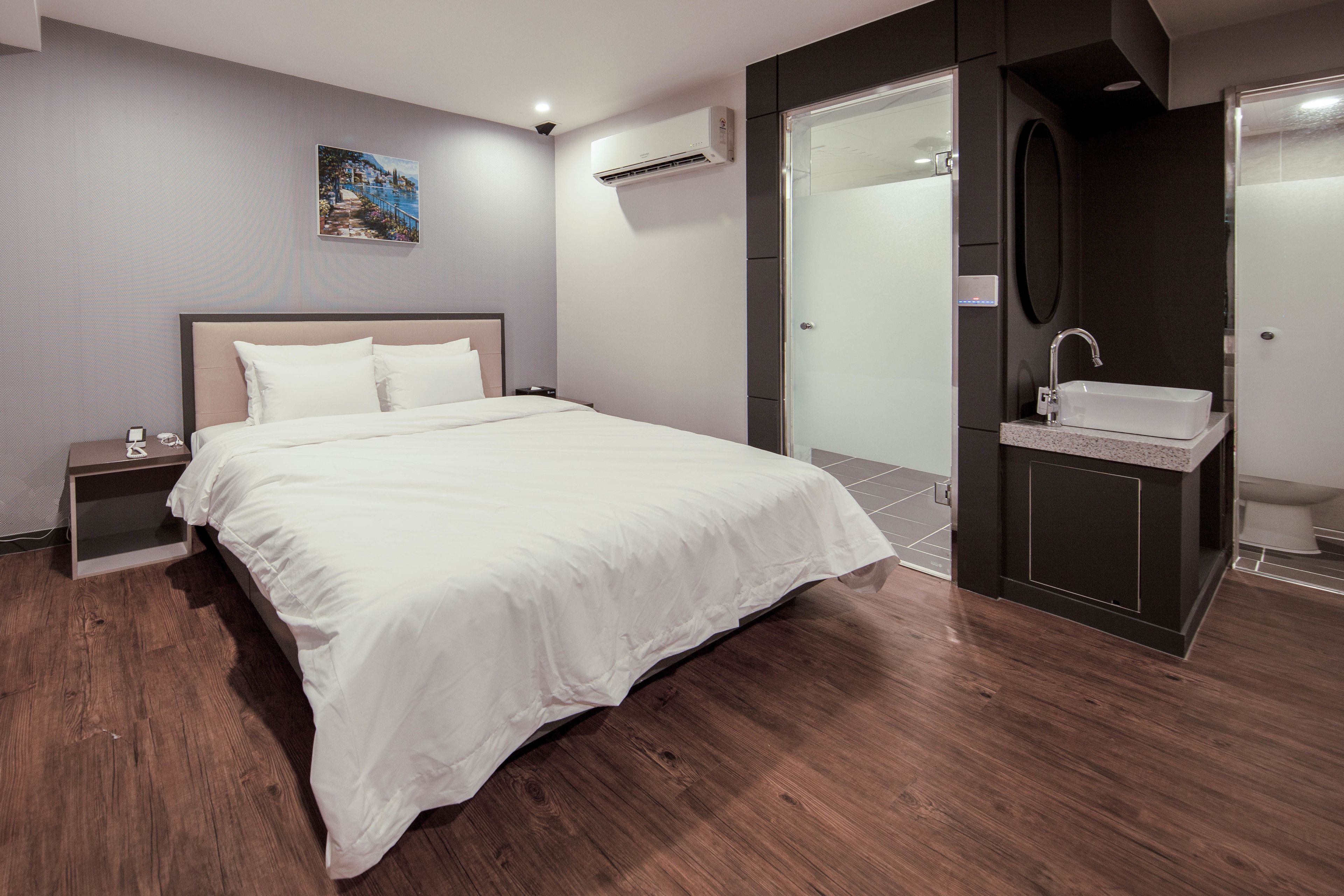premier deluxe king room | premium bedding, desk, laptop workspace, blackout curtains