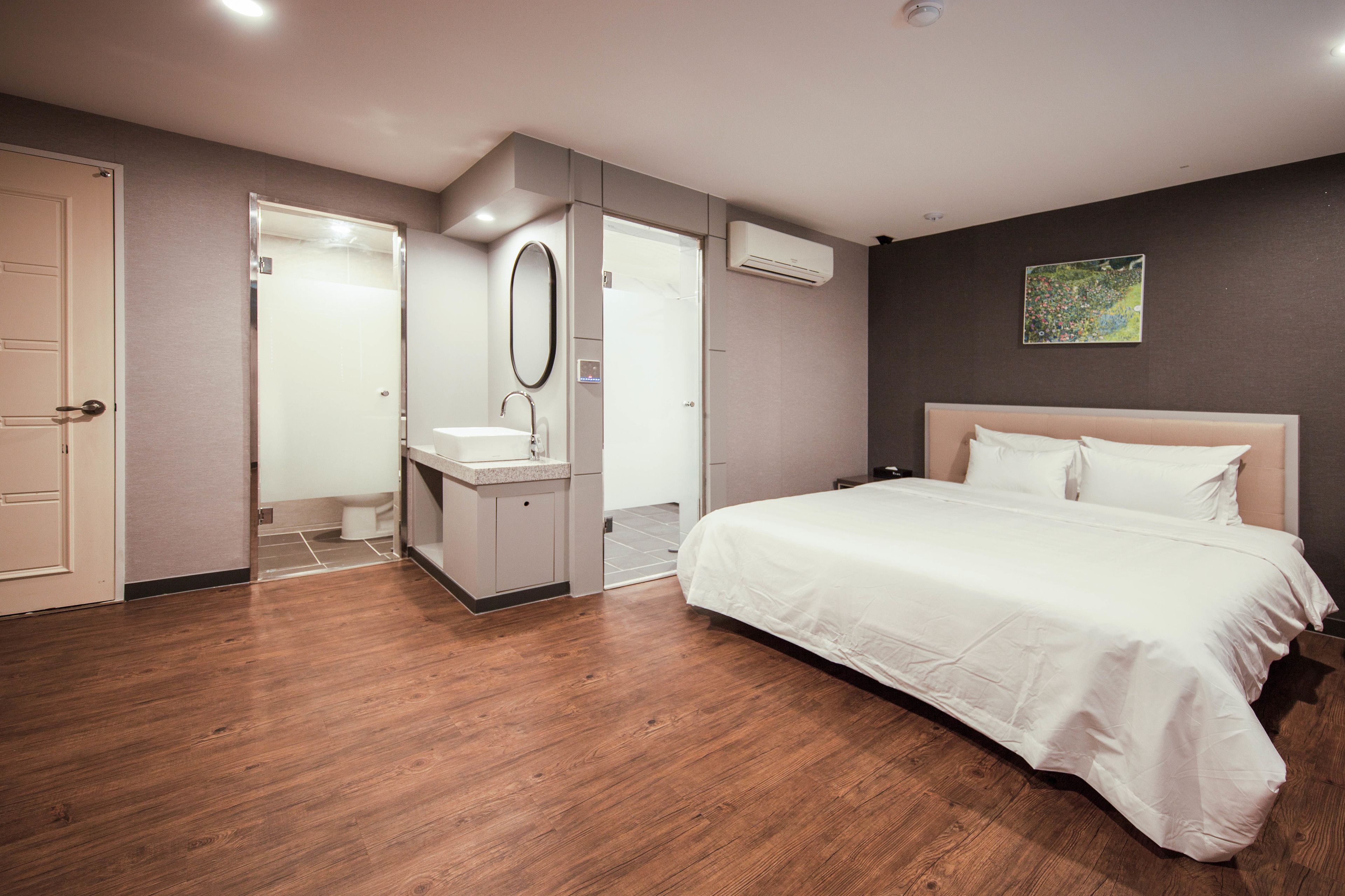 premier deluxe king room | premium bedding, desk, laptop workspace, blackout curtains
