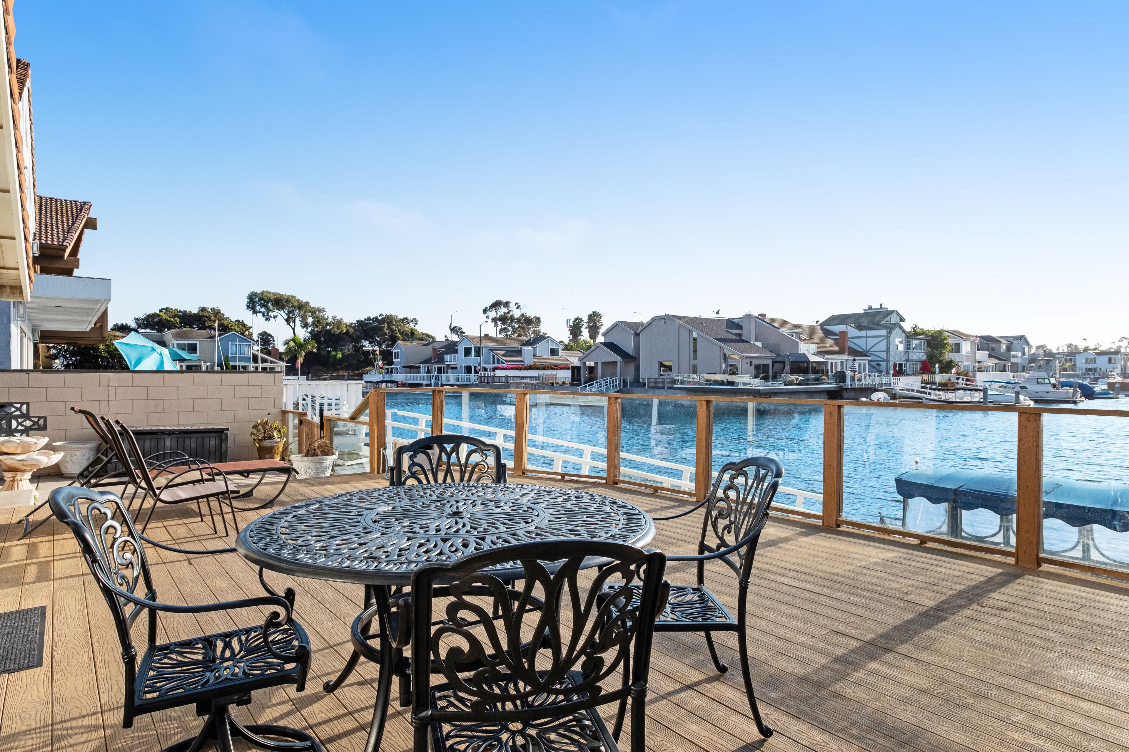 Waterfront home with kayaks, boat dock and large sun deck with harbor views