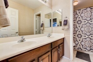 Combined shower/tub, hair dryer, towels, toilet paper