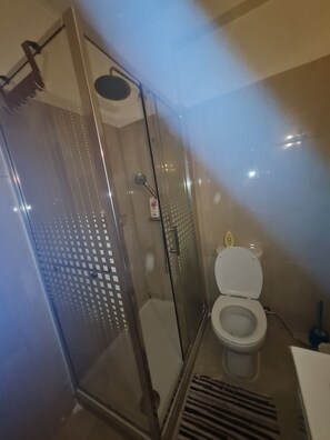 Shower, towels, soap, toilet paper