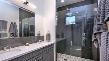 Combined shower/tub, hair dryer, towels, soap