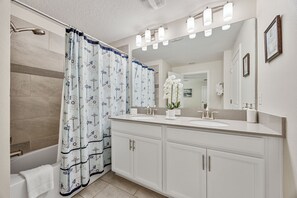 Bathtub, hair dryer, towels, soap