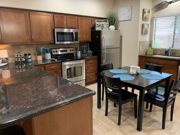 Enjoy cooking in this well-equipped kitchen with a dining area and plenty of storage.