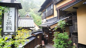 A traditional Japanese building with a sign indicating a tea house.