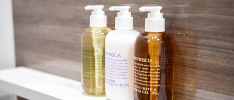 Three bottles of Provinscia products on a white shelf.