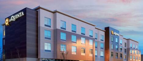 A multi-story hotel with a modern facade, featuring the brand name 'La Quinta' prominently displayed on the building.