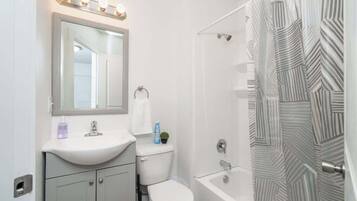 Bathtub, hair dryer, towels