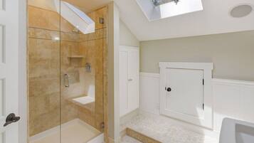 Combined shower/bathtub, hair dryer, towels, soap