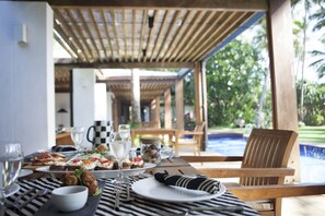 Outdoor dining - Beachfront villa with pool and full staff (Maggona)